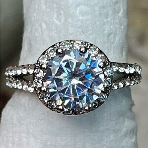 Stunning MOISSANITE ring with accented stones on side and on the crown. Size 7.5